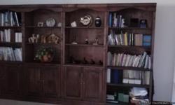 Moving Sale. Set of 6 wooden bookshelves with dark cherry finish. 3 units have shelves and 3 units have top shelves with cupboard bottom. Excellent condition.