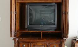This is a 2 piece TV armoire. The top half is the entertainment center with the inside dimensions to hold a TV without the 2 adjustable shelves placed inside: 37 1/2" wide, 40" tall and 19" deep. There are also 2 large openings separated by a shelf