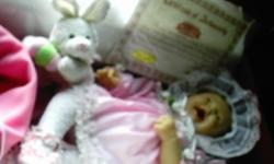 This special addition doll was designed by Salvador Berenguer. She is automatically correct and wears a diaper. Included with a bunny, a blanket and a extra hat. She has a very nice lilac smell to her.