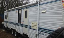 1996 Sportsman Travel Camper 32 ft with 1 slide out. This unit has a full front kitchen, walk thru full bathroom, rear bedroom with queen bed. This unit has a new water heater, New Carpet and Padding in Master Bedroom, Central Air Conditioning, Central