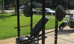 Squat power rack/cage with Olympic weights 300lbs. and incline and flat bench, easy curl bar included.