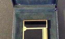 SLIGHTLY USED ST DUPONT LIGHTER IN EXCELLENT CONDITION IN ORIGINAL BOX-
LAQUE DE CHINE BLACK AND GOLDEN PLATED