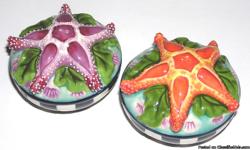 Starfish Blue Sky Clayworks Salt & Pepper Shakers
New with no Tags
These are so adorable, that they can even be used as decorations, you really can?t tell to much that they are Salt & Pepper shakers. You have an orange and purple starfish on a bed of