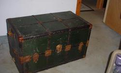 This is a "steamer trunk" made to transport wardrobe with built in drawers and wooden hangers