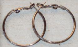 Non-Ornamental, Sterling-Silver Hoops ~ 1 Â¼? Diameter.
Classic Pierced Earrings with Secure Fastening Design.
 