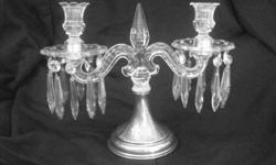 Goregous set of 2 sterling and crystal chandelier style candle holders. Each has a base that is stamped: Sterling s1155 83pwts. Thats a total of 166pwts. For a grand total of 8.3 troy ounces of sterling silver. These make a wonderful addition to any