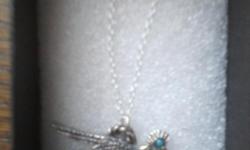 18 inch silver necklace with road runner charm brand new in box selling 10am - 5pm no shipping cash only.