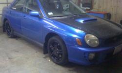2002 bug eye subaru, dc sport exhaust 2 inch down pipe, up pipe with external wastegate, racing clutch, front mount, upgraded breaks, alpine speakers, hid headlights, tinted brake lights, upgraded turbo to 68hta, plus a 03 mapping tune so it runs real