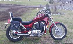 Beautiful red 2002 Suzuki Intruder VS 800cc. Bike has 19,279 miles on it and runs like new. Garage kept. Bike has only had non Ethanol gasoline run through it. Just tuned up for spring riding and has new battery also. Has saddle bags, windshield and lots