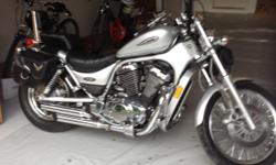 2003 Suzuki Intruder, Mint Condition, silver,&nbsp;10K miles, cruise control, leather side bags, buckhorn handlebars, extra battery, custom pipes,&nbsp;new tires, man's and lady's helmet