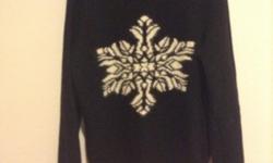 Black and white sweater with short chrew neck line.
100% lambswool
Designer: Bonnie Bill
Size: Large
great condition