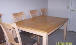 Contemporary design solid wood table, bleached maples with black etching. Size 60" x 42" with an 18" leaf, 4 side chairs.