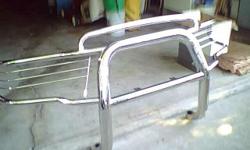 This grille guard fits on dodge 1500 96/03 new $760.00 used very little stainless steel sell's as is,515-865-9402