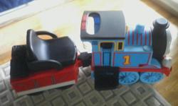 thomas the train ride on. includes figure eight track and expansion track valued at $200.00. also included ride through tunnel. contact -- or --
