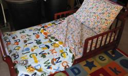 Cherry finish sleigh bed.&nbsp; ABC sheets plus comforter, mattress and rug.&nbsp; Still like new!&nbsp;