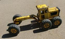This is a vintage Tonka grader.&nbsp; It has some rust and missing the blade but is still solid.