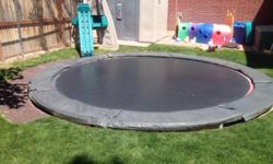 14 Ft. Trampoline with pad and funsport net.