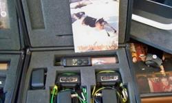 Tritronics two dog training collars the first one is the beagler model which will work on any dogs it has a one mile range and recent batterys.It also has all chargers needed to charge collars and transmitter.It comes with a nice carrying case.$300the