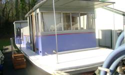 1969 Trojan 34' Houseboat. Fresh exterior paint, interior re-conditioned. Windows removed and sealed when replaced, new flooring, decks, walls with insulation. Good wiring, recessed lights, 30 amp circuit. Running water with on-demand water heater. Deep