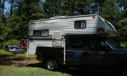 1999 Fleetwood slide-in truck camper. Completely self-contained and in great condition, everything works. Has fridge, oven, stove, microwave, bathroom with shower. Queen size bed and fold out extra bed. Also has outside shower. Fits 3/4 ton truck. Great