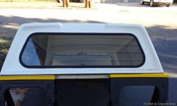 Lear fiberglass truck topper used on a 2004 GMC Canyon short-bed. No cranks, breaks, or damage. Also comes with 4 quick clamp brackets for mounting with No drilling necessary. Located in Byron. Contact @ --.