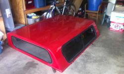 1997 S-10 Chevy short bed topper. Red. (304) 769-5464.
