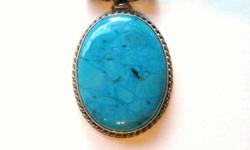 Large Turquoise Oval Pendant in a setting of Braided Sterling. Horizontal tube bail w/ swirl design adds drama and length to stone already 1-3/4" long by 1-1/4" wide. A statement piece that needs only your chain or cord to make a necklace that gets