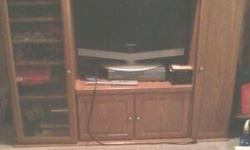 i have a wooden tv stand with storage on both sides and the bottom. $75
I have a cream dolphin table with glass table top $50