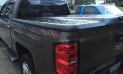 UnderCover Elite E black hard tonneau cover ? excellent condition, all parts and pieces included.&nbsp; Fits 2014-2016 Silverado with a 5?8? bed.&nbsp; UnderCover part number UC1118.&nbsp; Please note the only problem is the lock cylinder.&nbsp; While it