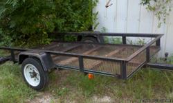 4x8 utility trailer with mesh bed and bed tilts..