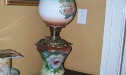 Victoran Hand Painted Oil Lamp. Never electerfied.
Appros 27 inches tall and 9 1/2 across middle brass