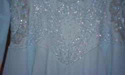 Beautiful embellished gown, price has been substantially reduced.&nbsp; Worn only a few times.&nbsp; Excellent condition.&nbsp; Long sleeves.&nbsp; 100% polyester chiffon.&nbsp; Dry clean only.Beading is made up of sequins and beads.&nbsp; The material