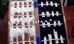 &nbsp;Vintage Chessboard Hand Carved with Genuine Ivory pieces
&nbsp;
Beautiful&nbsp;carved ivory chess set in case/board, with no flaws whatsoever as shown in the pictures, see photograph for details, white and brown hand carved tea colored, with wooden
