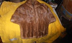 This 1960's mink stole is in outstanding conidition. It features two pockets and green silk lining with floral print.&nbsp; If you would like more detailed infomation give us a call at (815)419-4248 or you can email us at colonywoodcraft23@gmail.com