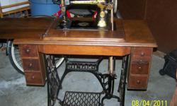 For sale is a 1922/23 Model 127 Singer Sewing Machine and cabinet. Machine is in working order and the cabinet is in good shape for it's age - it is the original cabinet. Brand "NEW" belt, new bobbins, new needles and some extra supplies and owners manual