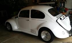 1963 VW Bug (1969 body on a undercoated 1963 pan)
Fresh 1835cc engine
Dual carbs
High output oil pump with spin on oil filter
Self adjusting valves
New custom exhaust system
Chromed engine compartment for showing
Close ratio four speed transmission
Two