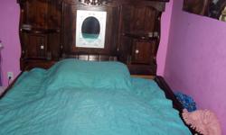 Waterbed Queen size complete. Dark wood. Heater about 2 years. $100.00 --.