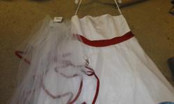 white wedding dress with red trim on back size 20 with veil,slip and coursette,brand new.veil is white with red cherry design. beautiful