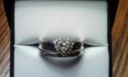 Silver wedding rings with heart shaped diamond cluster and crosses on each side. size 8.5 Asking 95.00&nbsp;