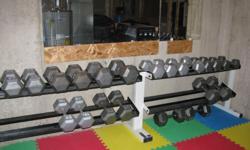 Complete set of dumbell pairs 10lbs to 75lbs by 5lb increments with 2 racks, and olympic barbell set with 2 x 45lb, 4 x 35lb, 4 x 25lb, 4 x 10lb, 4 x 5lb, 4 x 2.5lb with 1 weight tree.
