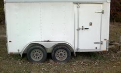 Wells Cargo Inclosed trailer. 6" X 12" double axle, electric brakes, interior light, double back doors and single side door. Clear Title.&nbsp; Make me an Offer.