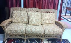 indoor/outdoor wicker sofa in like new condition.