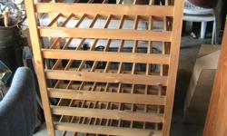 Wooden wine rack . can hold 80 bottles . Very good condition. $100.00. call Mike -.