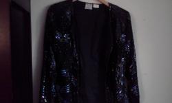 For a limited time only, you can buy this beautiful women's black 100% silk dress jacket adorned with sequins and beads for only $50.
Single hook & eye closing in front
Women's size L (fits size 14 to 16)
Measures 23-1/2 in. from shoulder to hem; sleeves