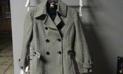 Just in time for the winter season! Size medium, beige and brown women's wool coat with a nylon lining that will keep you warm, dry and comfortable through all types of inclement weather, while staying in stride with the fashionistas and if wanting to