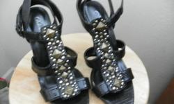 Size 7 womens high heel - has pretty stone decorations on shoe with strap.&nbsp; Man made (no animal) like new.