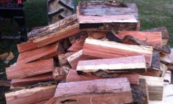 Good load of hard wood split and stacked
