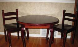Cherrywood finish table and chairs, great condition.