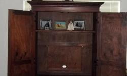 Beautiful TV/Armoire unit. All wood, excellent condition. Fits a large TV plus several game consoles,movies,games.etc.
