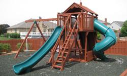 4 yrs old wooden swingset with two slides, rock climbing wall, fort, picnic table, 3 swings, and a pogo stick. It is in great condition. A must have for any kids and will keep them busy for hours. The swingset is framed by wooden railroad ties, and the